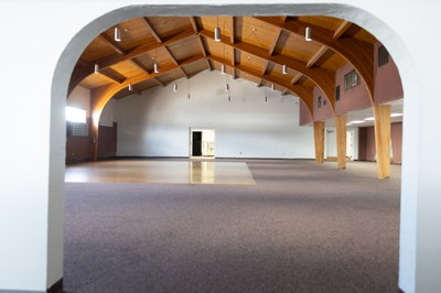 A large open room seen through an arched opening.