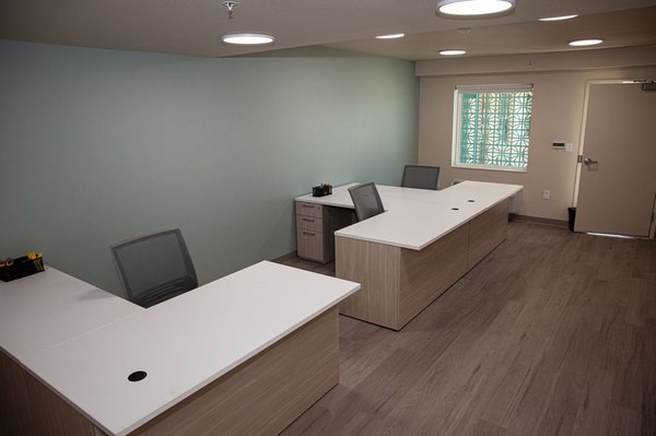 Office Space with desks and chairs located at the Young Adult Shelter.