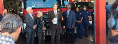 An image of Mayor Keller at a press conference outside a fire station.