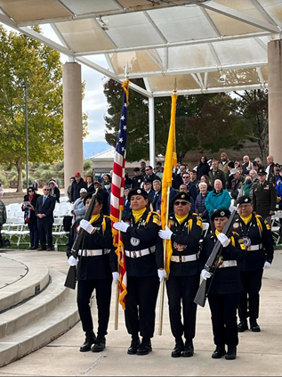 A color guard presenting the U.S and New Mexico flags.