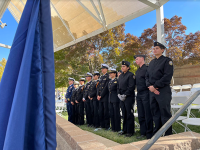 A row of military personnel stand next to each other.