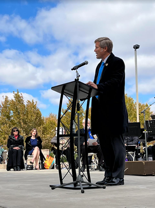 Mayor Keller speaking at a podium on Veteran's Day.