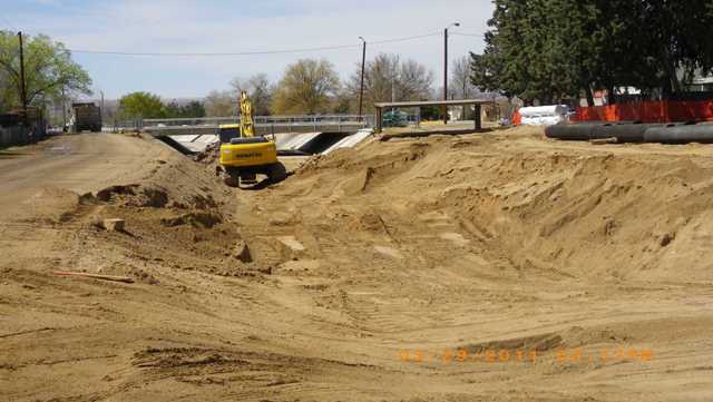 Removing concrete lining east of comanche bridge