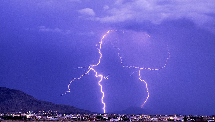 A jpg of blue lightning over the Sandias at night.