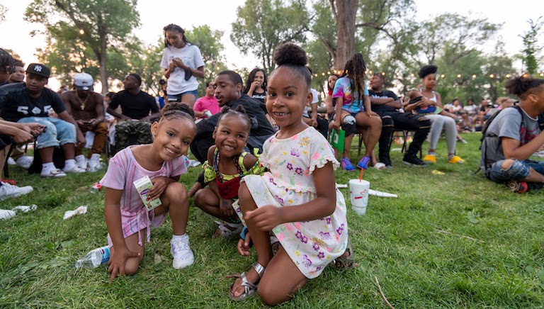 Photo of kids sitting in grass