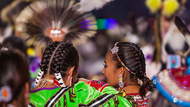 A photo of a Native American dancing