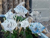 Fairwest Fish art sculpture of multiple fish swimming.