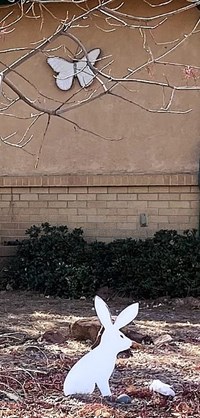 A small white rabbit artwork sculpture in the cut-out style.