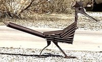 A metal artwork sculpture of a roadrunner in an exaggerated style.