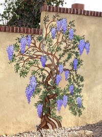 A wall painting of a tree with purple flowers.