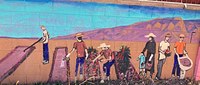 A wall art mural of a group of people gardening.