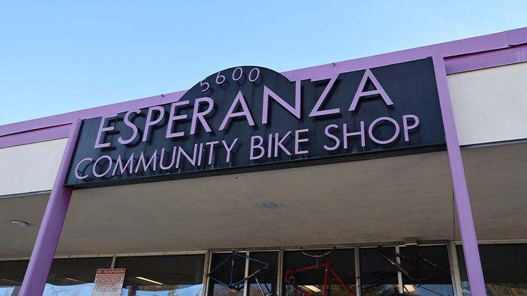 A building sign reading Esperanza