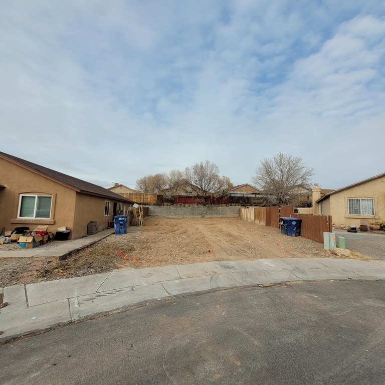 A clear residential lot after the dilapidated structure was demolished.