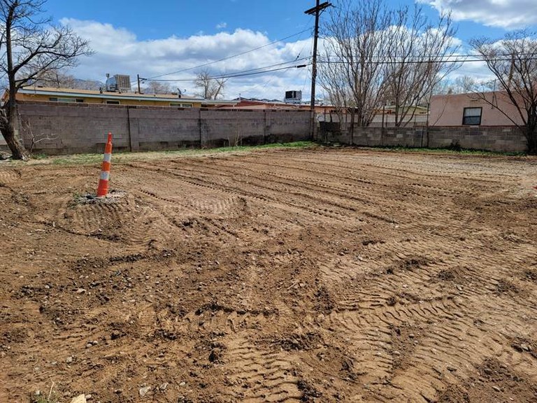 A clear residential lot after the dilapidated structure was demolished.