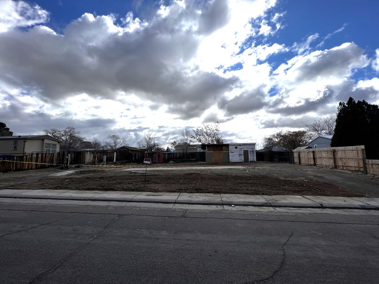 A clear residential lot after the dilapidated structure was demolished.