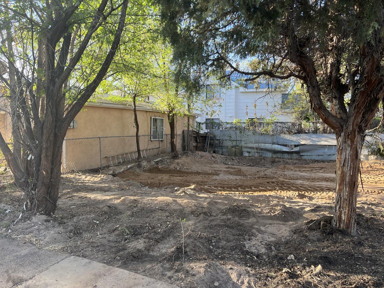 A clear residential lot after the dilapidated structure was demolished.