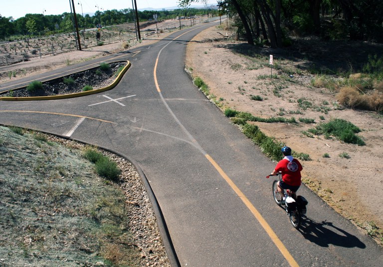 Image of a bicyclist riding near Tingley Beach.