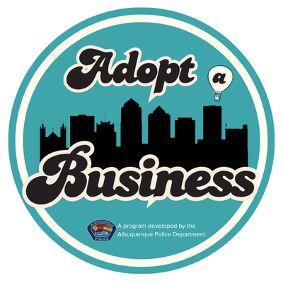 Adopt a Business Logo The words "Adopt a Business" with the "a" in a hot air balloon. The words are above and below a silouette of the Albuquerque sky line.
