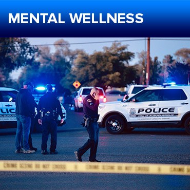 A jpg of the button for the Support Services section featuring a crime scene taped off with a police SUV in the background and a group of people talking to an officer in the midground.