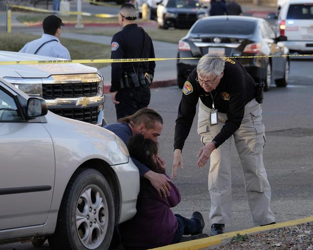 APD chaplain speaking to Albuquerque resident