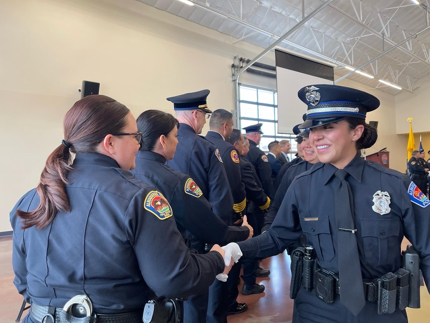 APD female officer during pinning ceremony