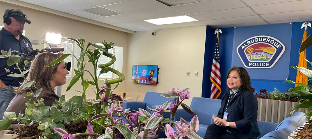 Media Relations Terry Huertaz, Victims Assistance Manager being interviewed by a reporter