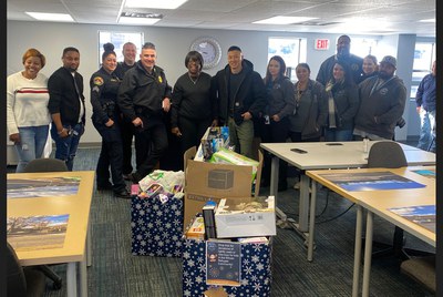 APD and ACS deliver gifts to African refugee organization