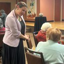 First Lady Elizabeth Keller greets an AmeriCorps Seniors volunteer