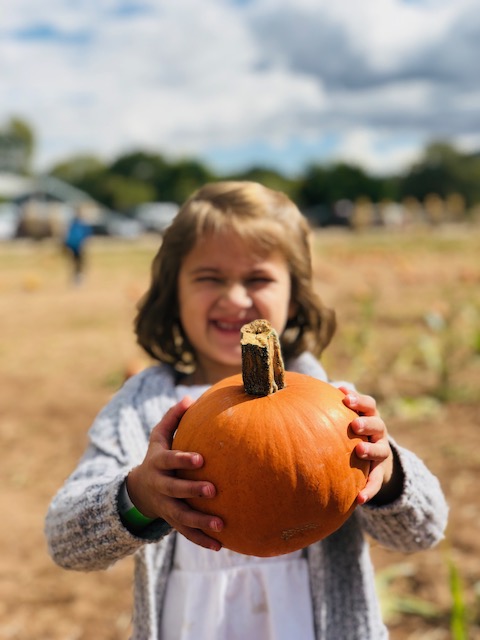 Youth with pumpkin