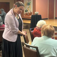 AmeriCorps Seniors Volunteers Honored for Years of Service at Pinning Ceremony