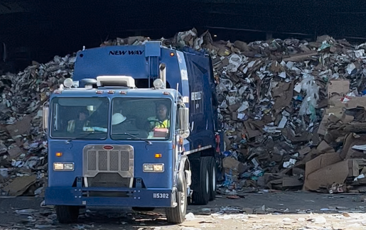 Recycling truck unloading recyclable material at the BARCO material recovery facility.