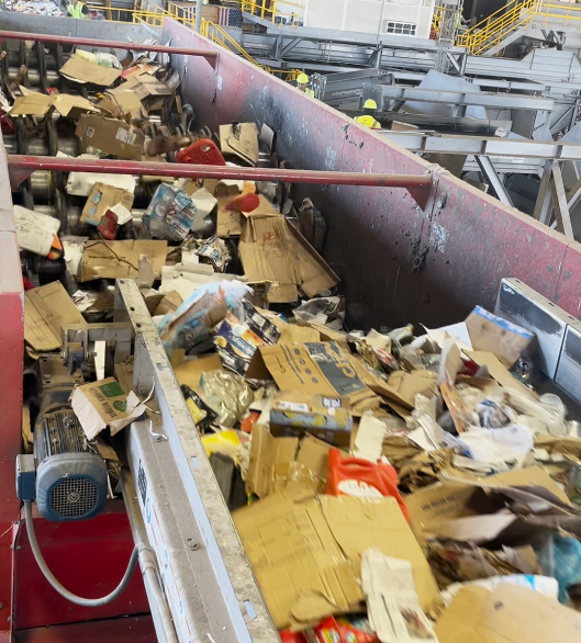 Machinery sorting cardboard in our recycling stream.