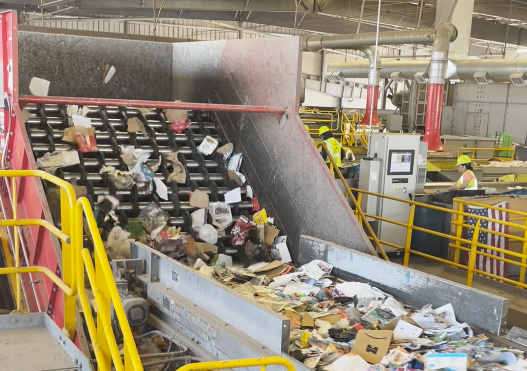Rigid plastics are sorted by machinery in the material recovery facility.