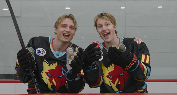 New Mexico Ice Wolves Recycling Two New Mexico Ice Wolves hockey players show an aluminum can, an example of a recyclable material.