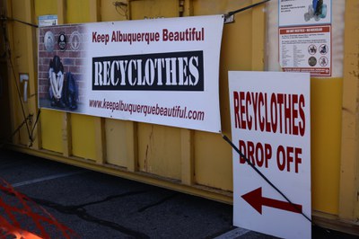 Recyclothes banner on side of yellow collections bin