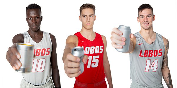 Players from the UNM Lobo Basketball Team posing with cans for the Recycle Right Campaign.