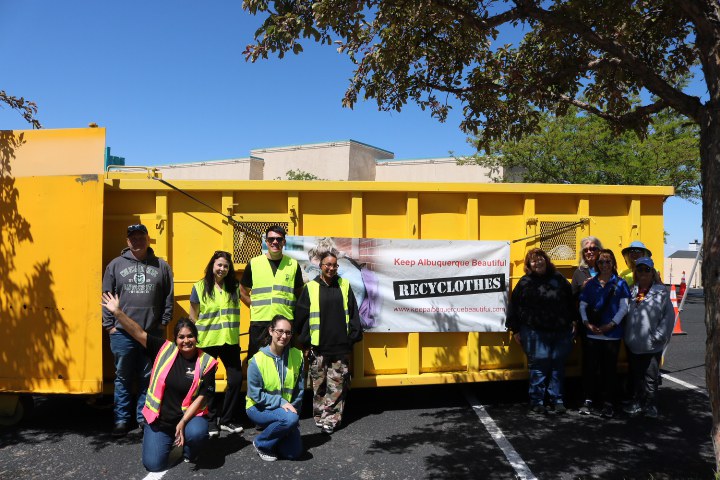 Volunteers pose with donations from annual 2025 Recyclothes Event