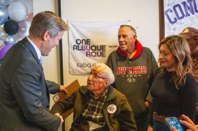 Ken Baugh Dedication Ken Baugh shaking hands with Mayor Tim Keller at renaming celebration.