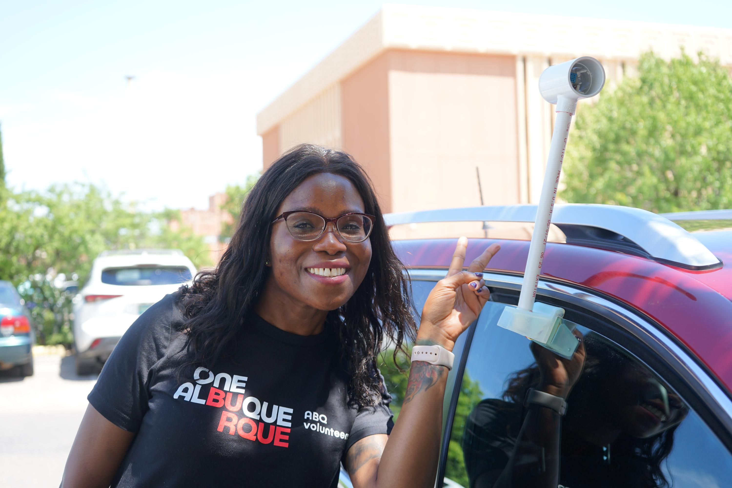 Volunteer collecting temperature data to help understand the urban heat island effect.