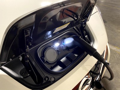 electric vehicle plugged into a charging station