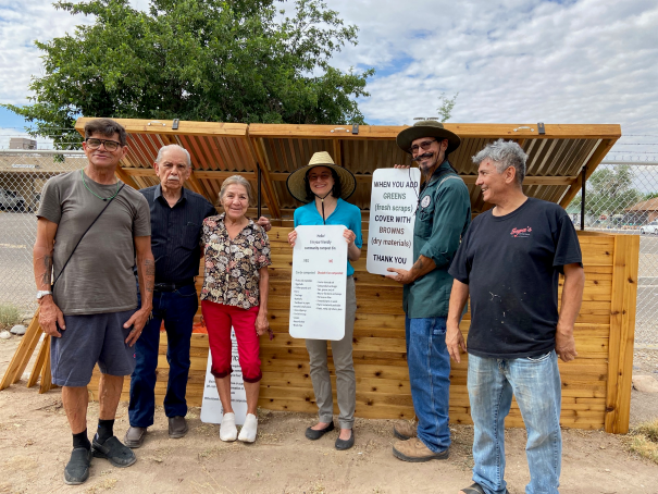 Community composters and City staff standing in front of the compost bins