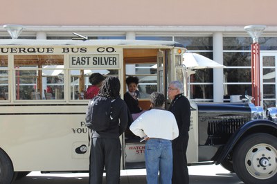 1927 Antique Bus parked in front of the Student Union Building at UNM to engage with students