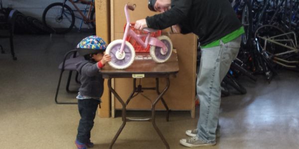 Esperanza Bike Shop Child and Bike Worker