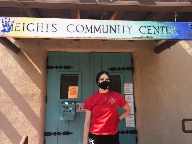 A recreation leader standing in front of the Heights Community Center