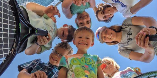 Children hiking on a trail via the Explorer Camp program.