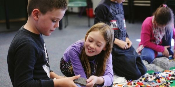 An image of children swimming in a pool.